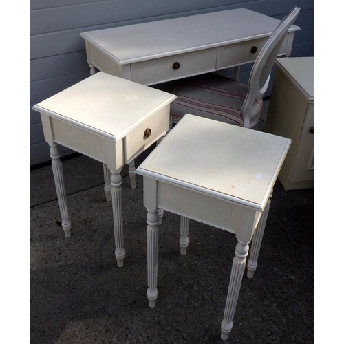 838 - A cream painted dressing table with pair of bedside tables and chair, together with a pair of cream ... 