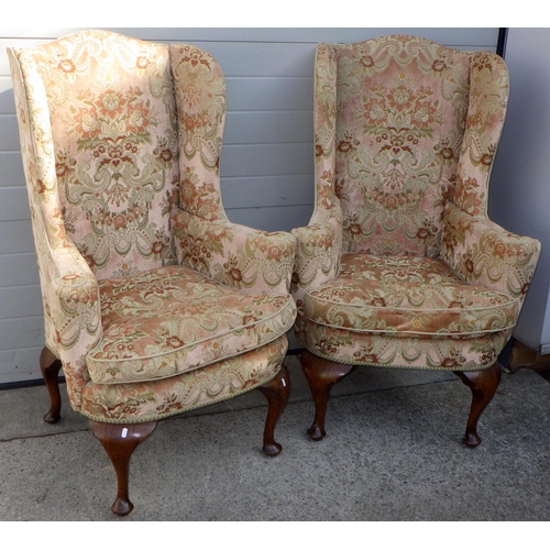 840 - A pair of wingback armchairs on oak cabriole legs, early 20th cen