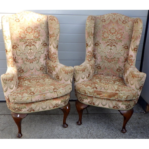 840 - A pair of wingback armchairs on oak cabriole legs, early 20th cen