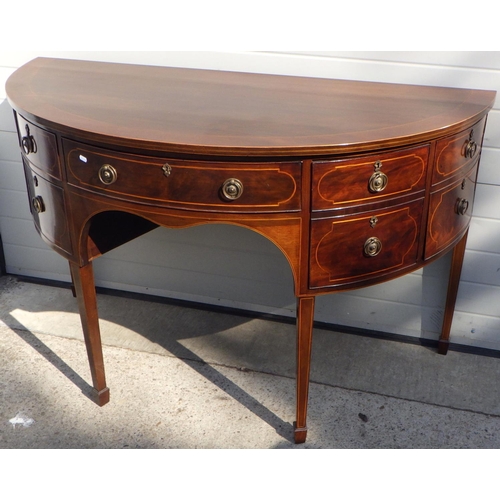 845 - A mahogany bowfronted sideboard, 157cm wide