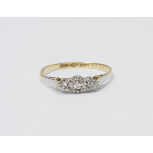 31 - A trilogy ring comprising three illusion set diamonds in an 18ct gold setting.  1.5g gross / Ring Si... 