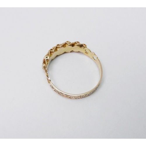 32 - A ring comprising seven graduated pearls in an unmarked yellow metal setting.  Ring Size O