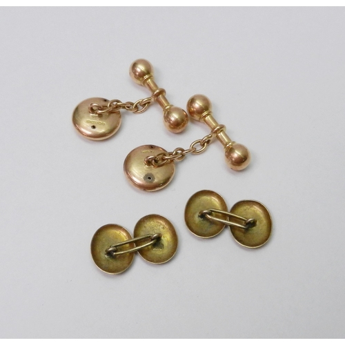 33 - A pair of Victorian chain link cufflinks comprising bar bell ends and engraved circular heads, 15ct ... 