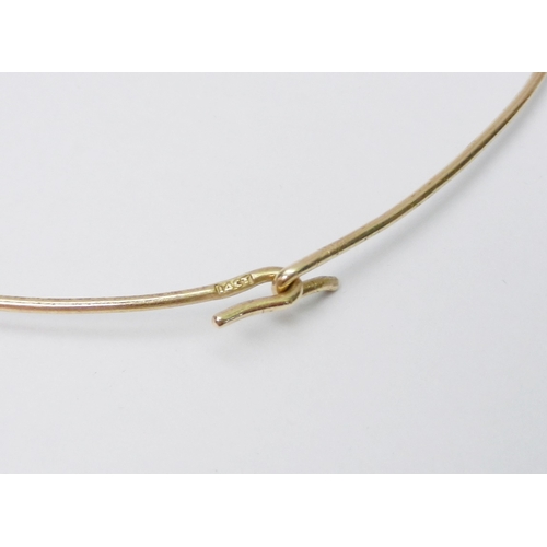 43 - A sprung necklace, yellow metal marked 14ct.  235mm clasp to indent.