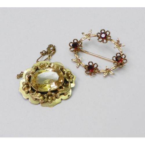 44 - A 9ct gold and garnet brooch, 34 x 27mm oval / 3.5g gross; a Victorian yellow metal and citrine mour... 