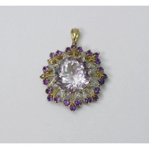 58 - A pendant of star-burst design comprising synthetic amethyst stones in a 9ct gold mount.  A/F stones... 