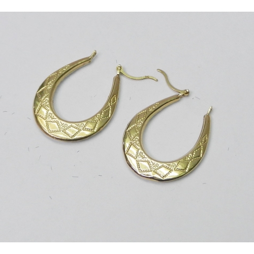 59 - A pair of horse-shoe hoop earrings, yellow metal marked 375 and paste.  Each 26mm long.