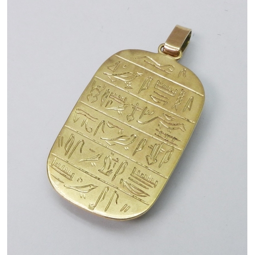 61 - An Egyptian scarab pendant inset with basalt, hieroglyphic motif inscription verso, indistinctly mar... 