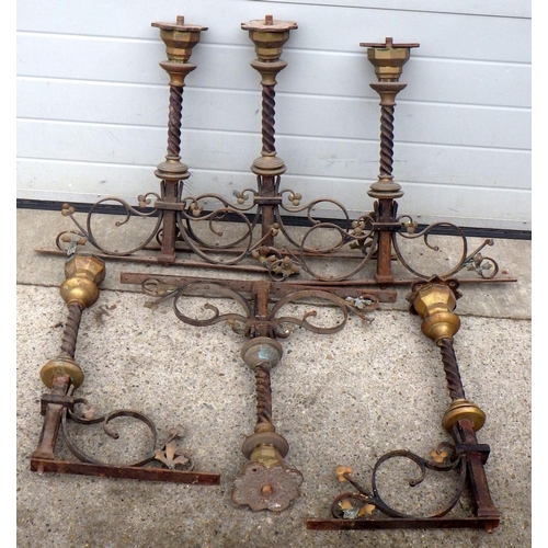 855 - A qty of wrought iron & brass balustrade hardware