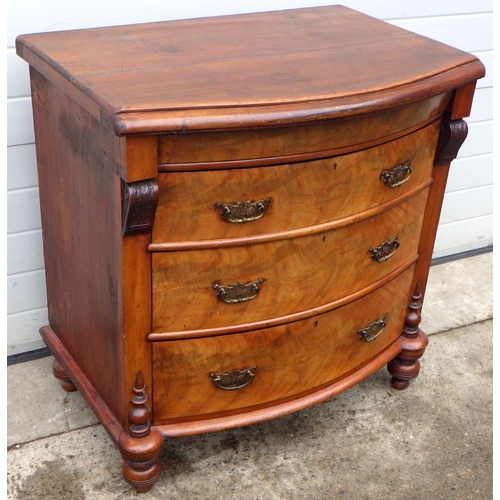 868 - A bowfronted chest of drawers, probably formerly part of a wardrobe, 92cm wide