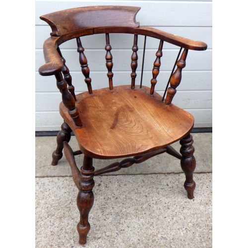 883 - A pad arm Windsor chair together with a smokers bow armchair (2)