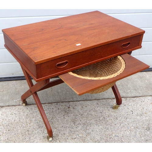 884 - A teak work table with contents, 70cm wide