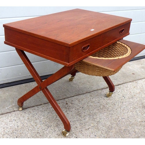 884 - A teak work table with contents, 70cm wide