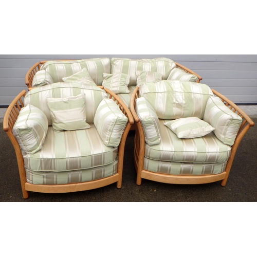 888 - A blonde Ercol three piece suite