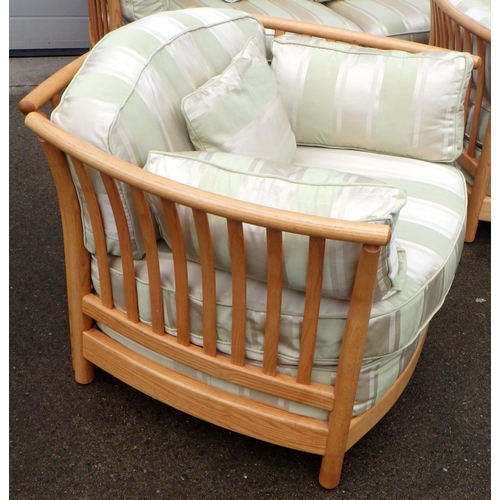 888 - A blonde Ercol three piece suite