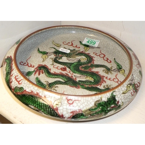 499 - A Chinese crackle glaze circular bowl decorated with dragons 27cm diameter