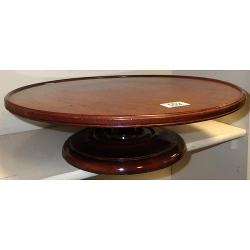 502 - A mahogany lazy Susan 46cm diameter together with a foot stool (old worm & repairs) (2)