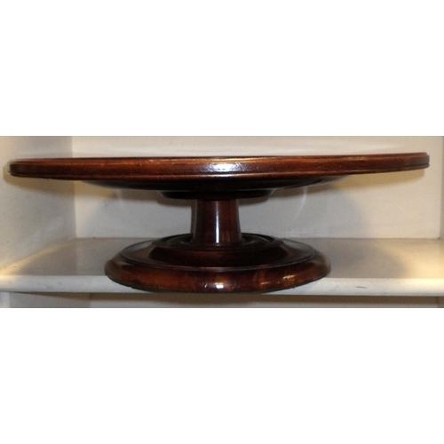 502 - A mahogany lazy Susan 46cm diameter together with a foot stool (old worm & repairs) (2)