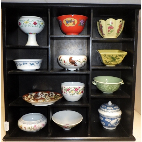 503 - Two display shelves containing miniature Oriental vases, tea bowls etc