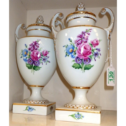 130 - A pair of porcelain Furstenberg painted urns 28cm tall