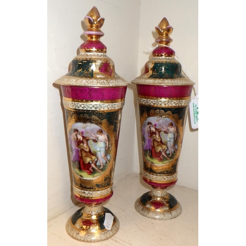 131 - A pair of Austrian porcelain lidded vases 27cm tall
AF hairline crack to one