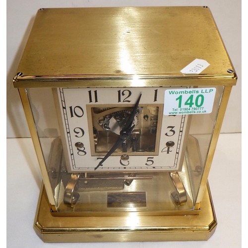 140 - A skeleton mantel clock in a brass case with perspex glazing, the German Shatz 7 jewel movement stri... 