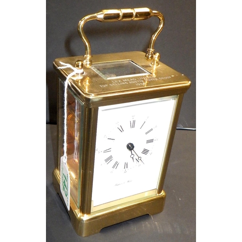 142 - A Mappin & Webb brass cased carriage clock,  presentation engraving to top plate. 13cm tall