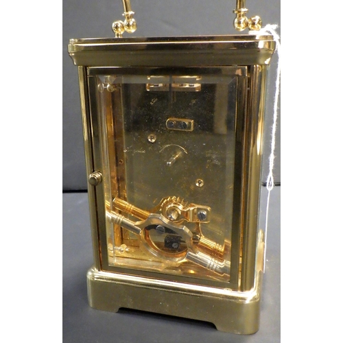 142 - A Mappin & Webb brass cased carriage clock,  presentation engraving to top plate. 13cm tall