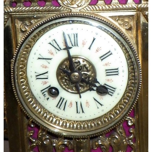 144 - A French brass cased mantel clock, the movement signed AM, striking on a single bell.  39cm tall.