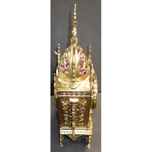 144 - A French brass cased mantel clock, the movement signed AM, striking on a single bell.  39cm tall.