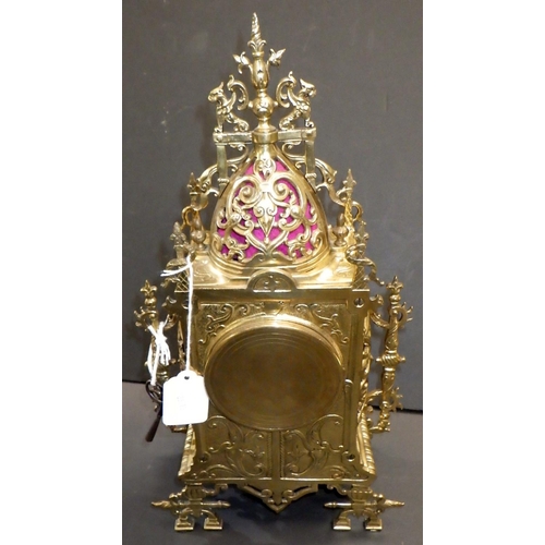 144 - A French brass cased mantel clock, the movement signed AM, striking on a single bell.  39cm tall.