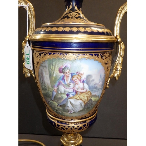 149 - A continental urn-shaped table lamp, the blue glazed porcelain body incorporating hand painted panel... 