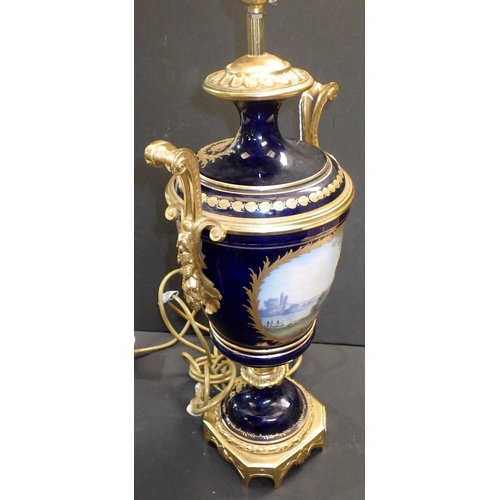 149 - A continental urn-shaped table lamp, the blue glazed porcelain body incorporating hand painted panel... 