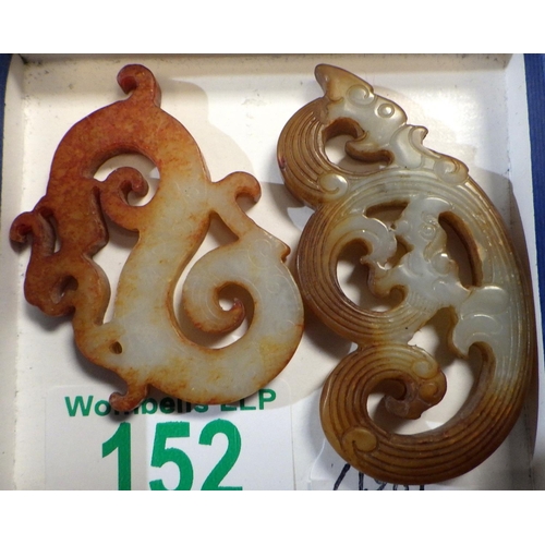 152 - Two Chinese openwork hardstone amulets. The larger 6.5cm tall