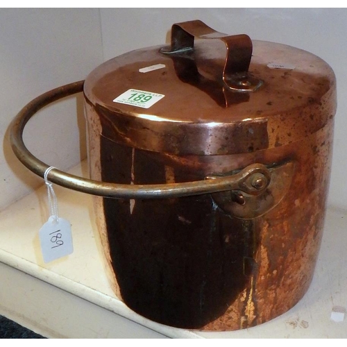 189 - A large copper lidded pot 24cm diameter