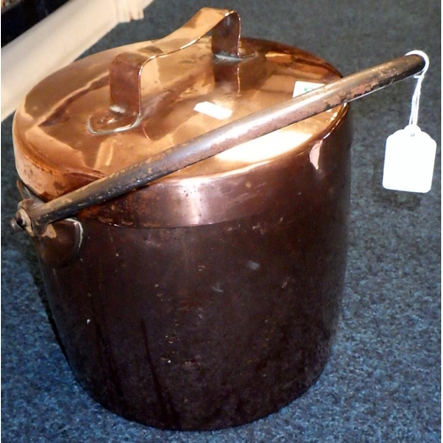 189 - A large copper lidded pot 24cm diameter