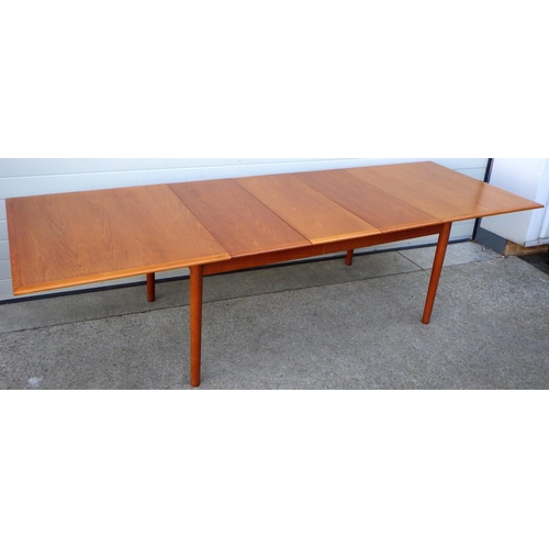 907 - An extending teak dining table with three leaves, 168cm long closed, 288cm long incl leave 100cm wid... 