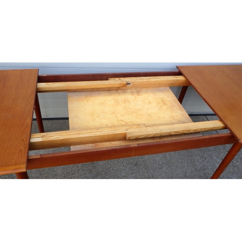 907 - An extending teak dining table with three leaves, 168cm long closed, 288cm long incl leave 100cm wid... 