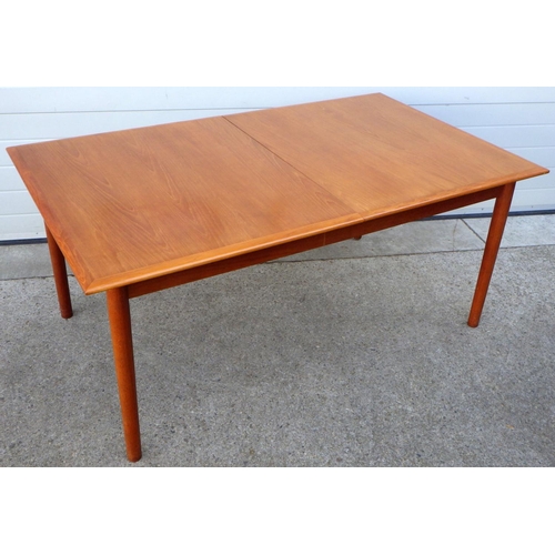 907 - An extending teak dining table with three leaves, 168cm long closed, 288cm long incl leave 100cm wid... 