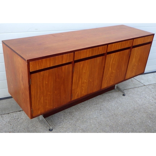 909 - A teak four door sideboard, 184cm long, missing one foot