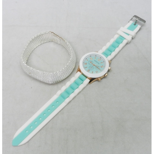 103 - A Milanese mesh bracelet, white metal having inner rectangular tag with rounded ends bearing the une... 