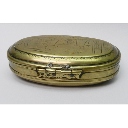 108 - An oval brass sweetmeat? nut? snuff? box, Continental having hinged lid, engraved front and back wit... 