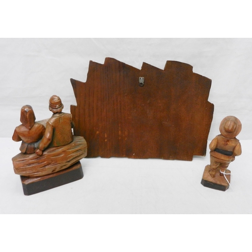 117 - Two carved wooden figures together with a similar high relief wall plaque