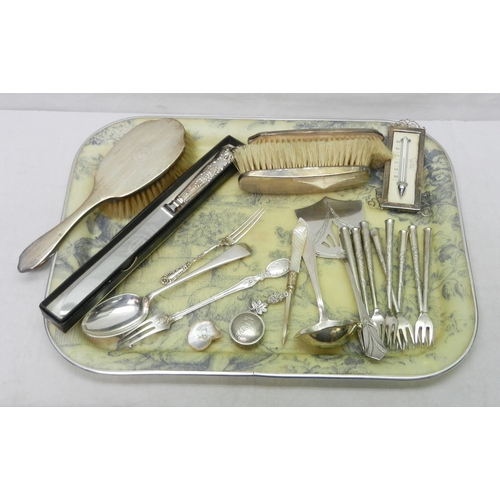 23 - Three silver backed hair brushes; white metal and other cutlery; etc. A/F