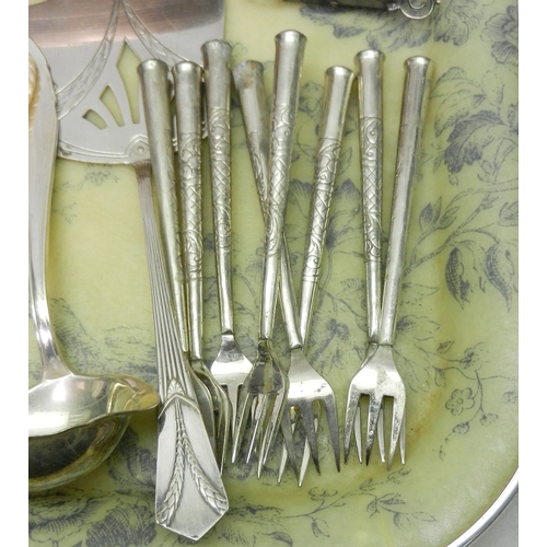 23 - Three silver backed hair brushes; white metal and other cutlery; etc. A/F