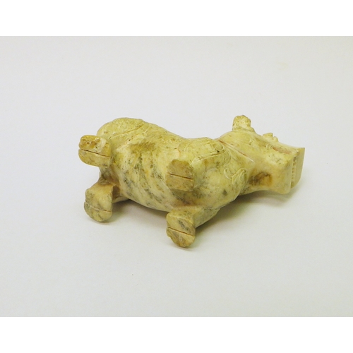 164 - A Chinese carved stone beast? rhinoceros? decorated with scroll motifs, 70mm long.