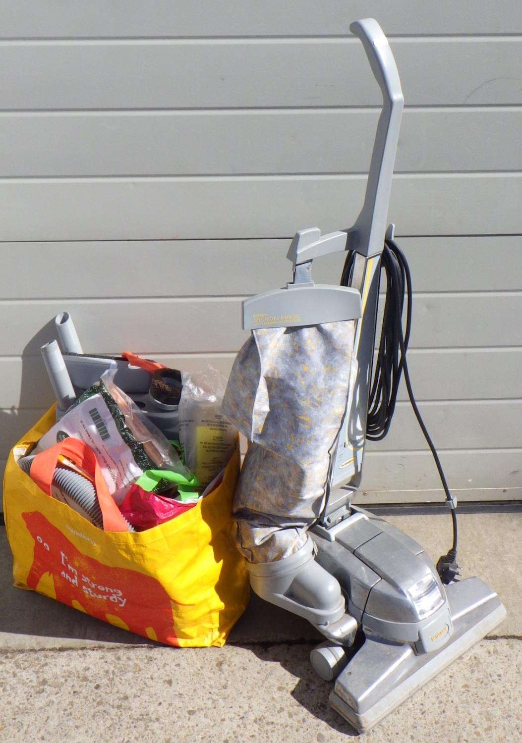 A Kirby Ultimate G series, upright vacuum cleaner with accessories