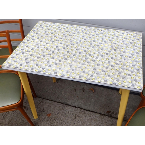 A 1960's formica topped kitchen table together with four chairs (5)