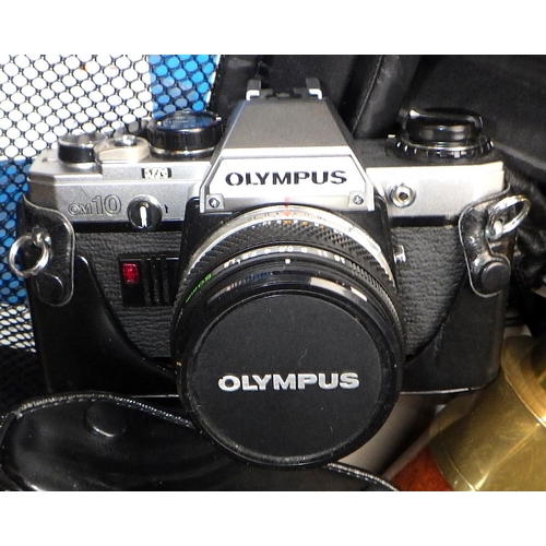 61 - An Olympus CM10 camera together with further cameras and a modern telescope