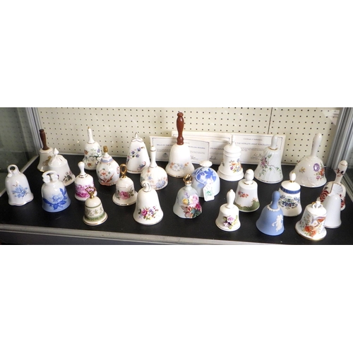 87 - A collection of Bells Of The World's Great Porcelain Houses together with a display shelf. (29)